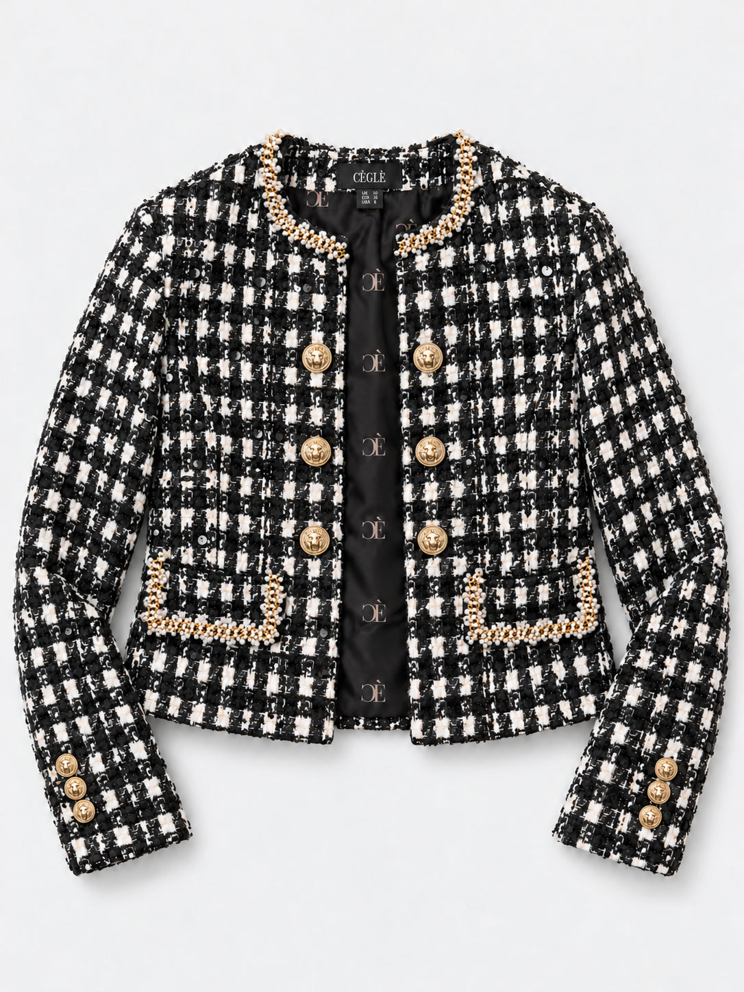 CÈGLÈ luxury tweed blazer in a black and white houndstooth pattern, featuring gold-tone buttons and matching gold chain pearl trim along the collar, pocket edges, and cuffs. CÈGLÈ monogram lining.